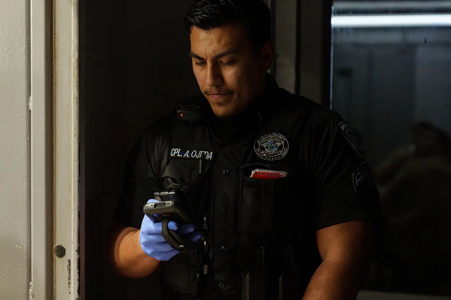 Why use Command Cloud - officer holding SPARTAN copy